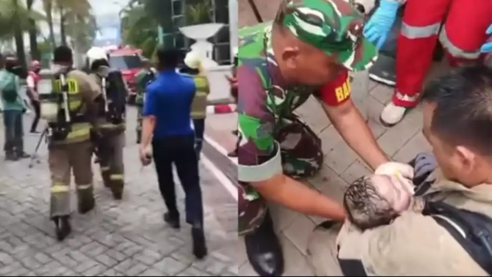 Petugas damkar mengevakuasi bayi saat kebakaran Apartemen Pavilion di Tanah Abang Jakarta Pusat